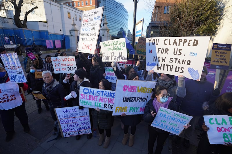 Members of the Royal College of Nursing on the picket line outside King's College Hospital, London, as nurses strike over pay. PA