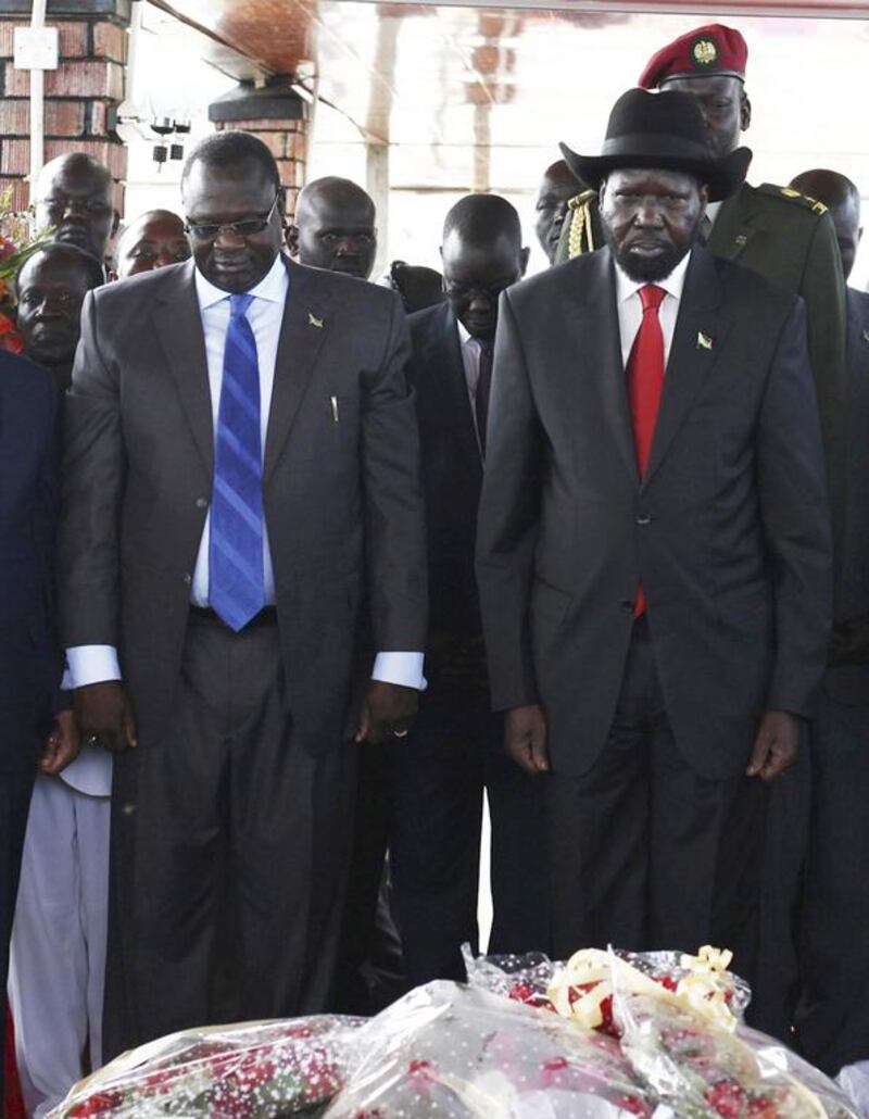 South Sudan's then vice president Riek Machar (left) and President Salva Kiir pay their respects at John Garang's Mausoleum in Juba on the second anniversary of South Sudan becoming an independent state on July 9, 2013. Andrea Campeanu / Reuters





