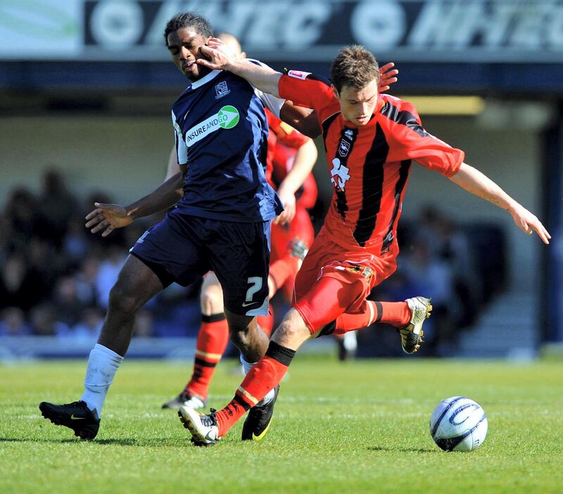 Southend United's Anthony Grant (left) and Brighton and Hove Albion's Ashley Barnes battle for the ball during the Coca-Cola League One match at Roots Hall, Southend.   (Photo by Clive Gee/PA Images via Getty Images)