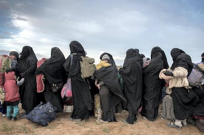 Women and children wait to be screened after fleeing from the last pocket of ISIS territory outside Baghouz, 28 February 2019. Campbell MacDiarmid