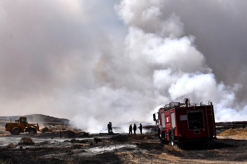 Firefighters try to extinguish the fire at at the Al-Mishraq sulphur field, southern Mosul city, north of Iraq. EPA