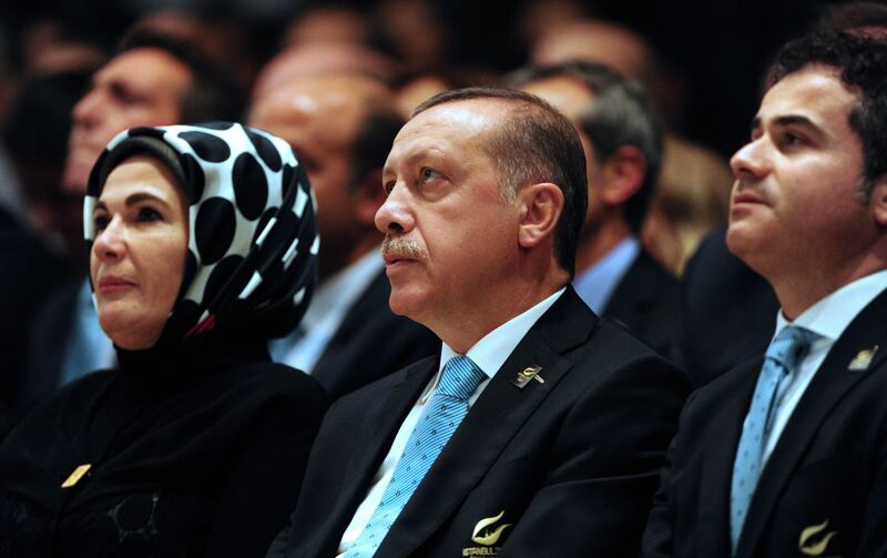 Turkish Prime Minister Recep Tayyip Erdogan (C) reacts alongside Istanbul 2020 delegation members after the Japanese capital was announced as the winner of the bid to host the 2020 Summer Olympic Games, during the 125th session of the International Olympic Committee (IOC), in Buenos Aires, on September 7, 2013. The three cities bidding to host the 2020 Summer Olympics -- Madrid, Istanbul and Tokyo -- delivered their final presentations ahead of the expected tight vote by the IOC, though Madrid was eliminated from the race moments after, in the first round of voting.  AFP PHOTO / DANIEL GARCIA
 *** Local Caption ***  892505-01-08.jpg