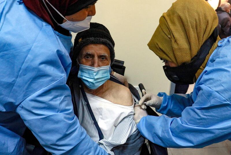 An elderly man receives a dose of the Chinese Sinopharm vaccine against the coronavirus COVID-19 disease, at a vaccination centre in the Jordanian capital Amman, on January 13, 2020.  Jordan had approved the Sinopharm vaccine for emergency use, after giving the Pfizer-BioNTech jab the green light.
The Hashemite kingdom has officially registered more than 305,000 novel coronavirus cases and nearly 4,000 deaths.
 / AFP / Khalil MAZRAAWI
