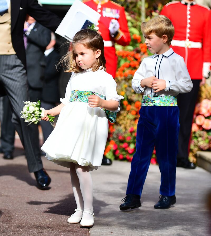 Princess Charlotte and Prince George attend the wedding of Princess Eugenie of York to Jack Brooksbank at St George's Chapel, Windsor, in October 2018.