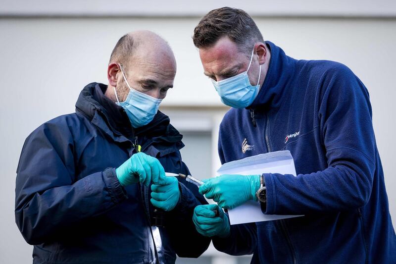 Forensics police officers investigate the Embassy of Saudi Arabia in The Hague after it was shot. AFP, ANP