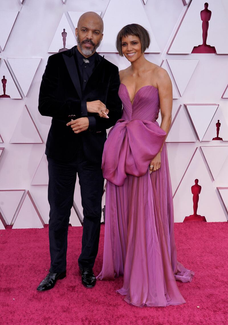 Van Hunt, left, and Halle Berry arrives at the 93rd Academy Awards at Union Station in Los Angeles, California, on April 25, 2021. AP