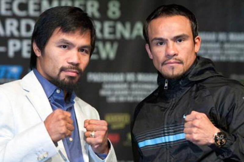 Manny Pacquiao and Juan Manuel Marquez square off ahead of their fight in Las Vegas.