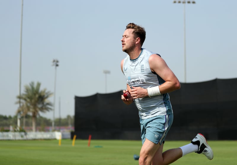 Ollie Robinson bowls during training in Abu Dhabi