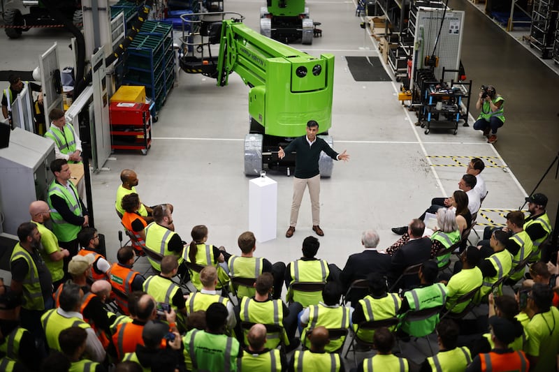 Mr Sunak holds a question and answer session during a visit to Niftylift in Milton Keynes. EPA