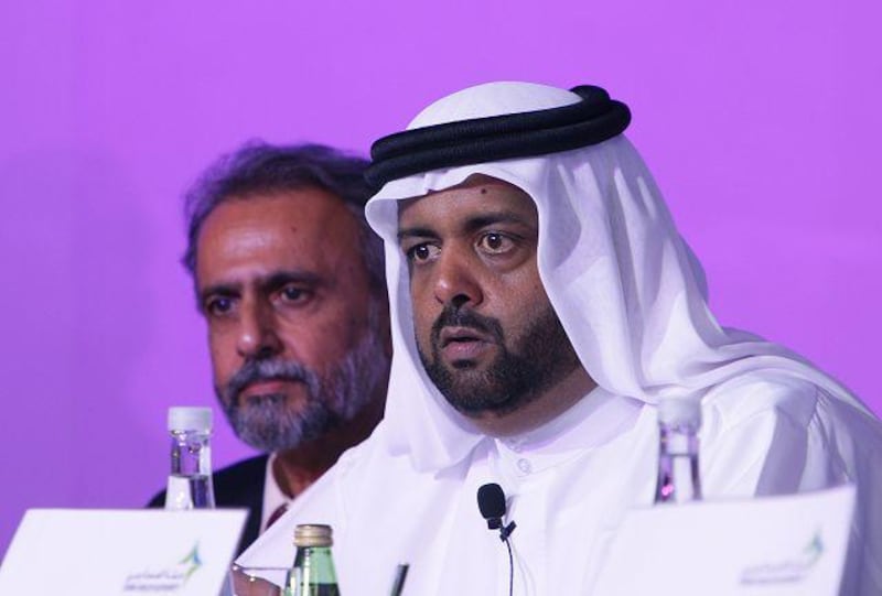Qadhi Saeed al Mrooshid, right, the director general of the Dubai Health Authority, says their aim is to educate and create awareness about breast cancer. At left is Dr Essa Kazim of the health authority in a file picture from 2008.