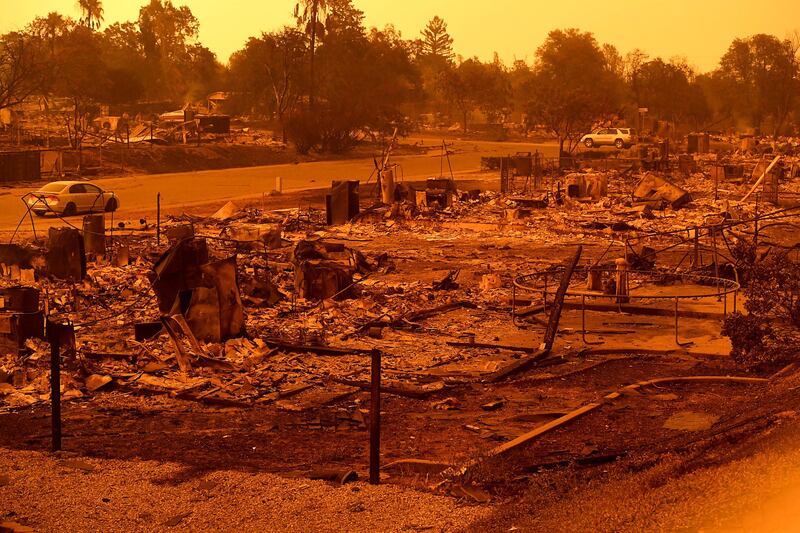 Homes leveled by the Carr Fire line the Lake Keswick Estates area of Redding, Cali.  AP Photo / Noah Berger