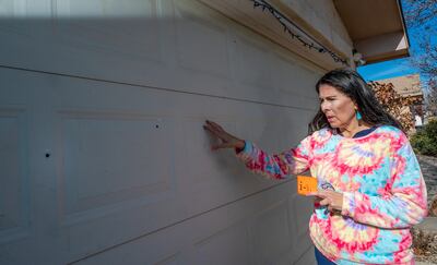 Senator Linda Lopez shows bullet holes in her garage door after her Westside home was shot at on Thursday January 5. AP