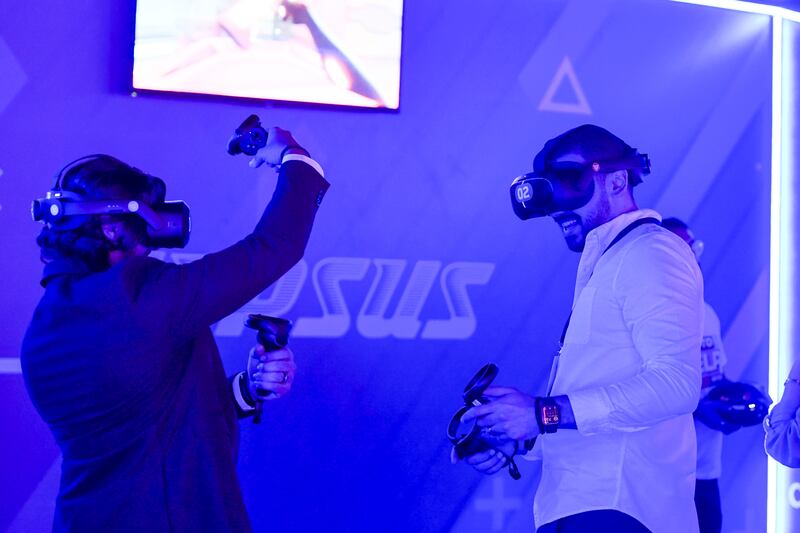 People play the VR game Versus at the festival
