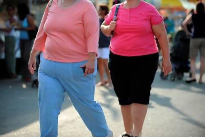 Obesity has been proven to cause health problems, but just being a bit overweight may not be all that bad. Tim Sloan / AFP