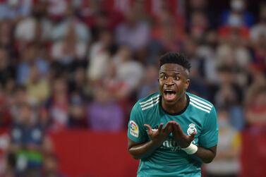 Real Madrid's Brazilian forward Vinicius Junior reacts after his goal was cancelled during the Spanish League football match between Sevilla FC and Real Madrid CF at the Ramon Sanchez Pizjuan stadium in Seville on April 17, 2022.  (Photo by CRISTINA QUICLER  /  AFP)
