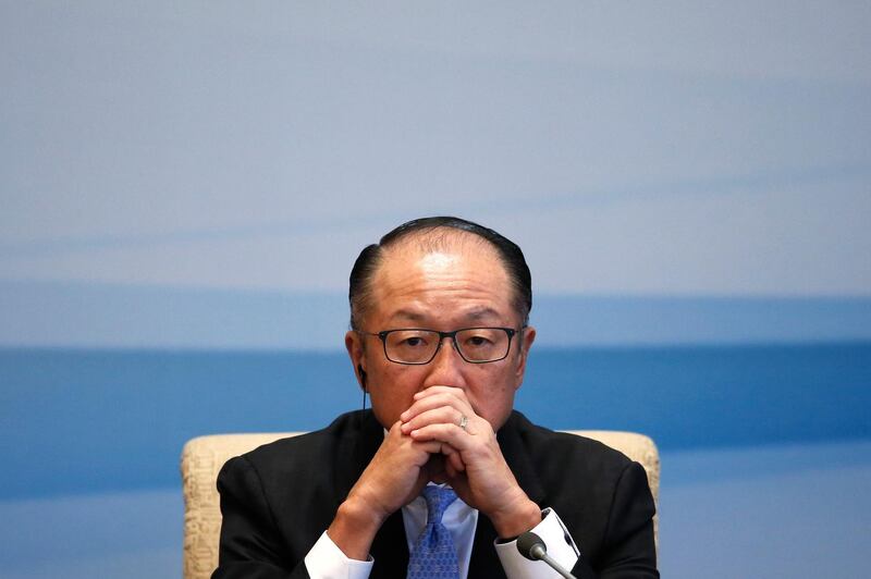 FILE- In this Sept. 12, 2017, file photo World Bank President Jim Yong Kim pauses during a joint press conference for the 1+6 Roundtable Dialogue at the Diaoyutai State Guesthouse in Beijing. Kim says he is resigning at the end of January. Kim's unexpected departure nearly three years before his term was set to expire, is likely to set off a fierce battle between the Trump administration and other countries who have complained about the influence the United States exerts over the World Bank(AP Photo/Andy Wong, File)