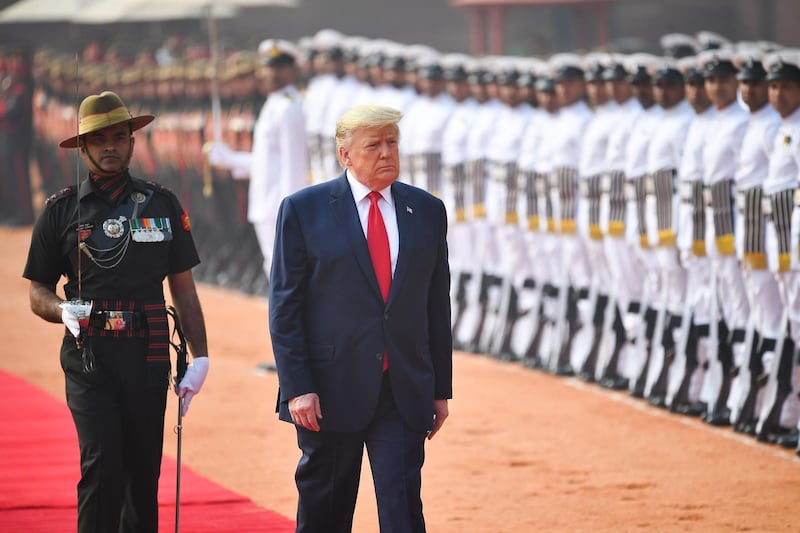 US President Donald Trump reviews a guard of honour during a ceremonial reception at Rashtrapati Bhavan, the Presidential Palace, in New Delhi. AFP