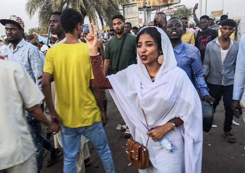 To the refrain of "revolution" shouted by the crowd, the slender Ms Saleh chanted: "They burned us in the name of religion, killed us in the name of religion, jailed us in the name of religion."