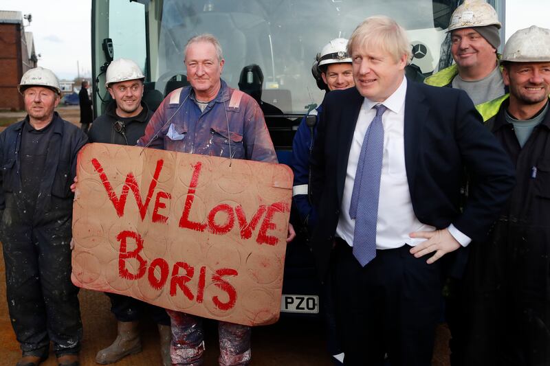 Mr Johnson poses with workers as he is given a tour of Wilton Engineering Services as part of an election campaign trail stop in November 2019, in Middlesbrough. Getty Images