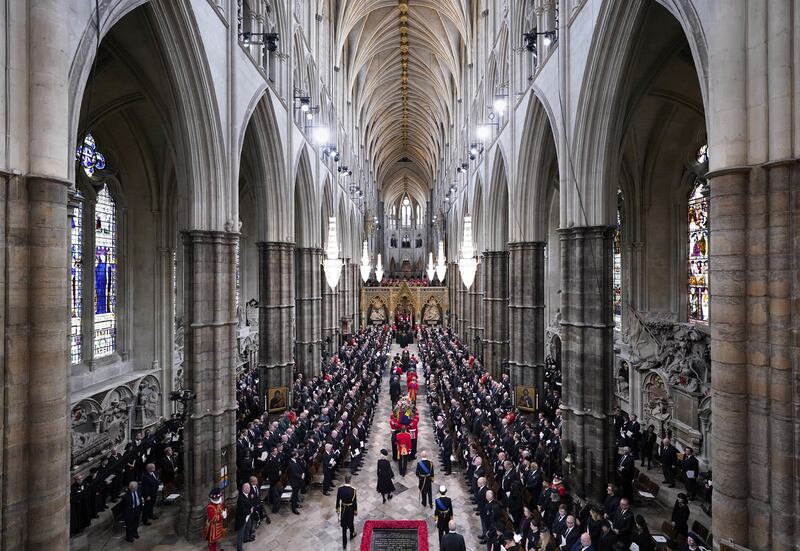 King Charles and members of the royal family follow behind the coffin as it is carried into Westminster Abbey. PA