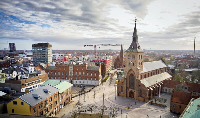 Aerial view of the St. Canute's Cathedral (Sankt Knud Kirke) in Odense, the birthplace of Swedish writer Hans Christian Andersen, on April 9, 2020, Denmark, in the early morning during the novel coronavirus COVID-19 lockdown. (Photo by Mikkel Berg Pedersen / Ritzau Scanpix / AFP) / Denmark OUT