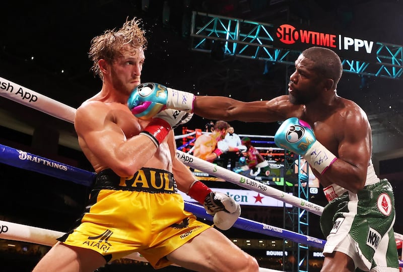 Floyd Mayweather punches Logan Paul during their exhibition boxing fight at Hard Rock Stadium in Miami. AFP