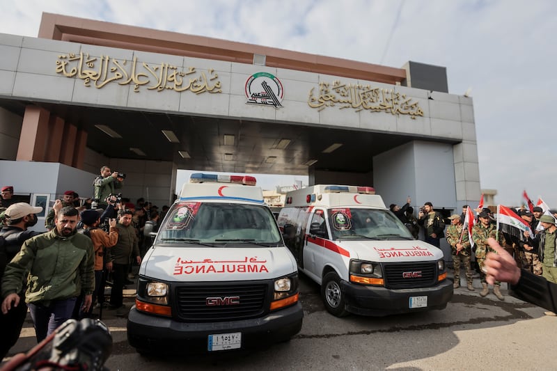Ambulances carry the coffins of Iraqi Shi'ite armed group members who were killed by a US air strike. Reuters