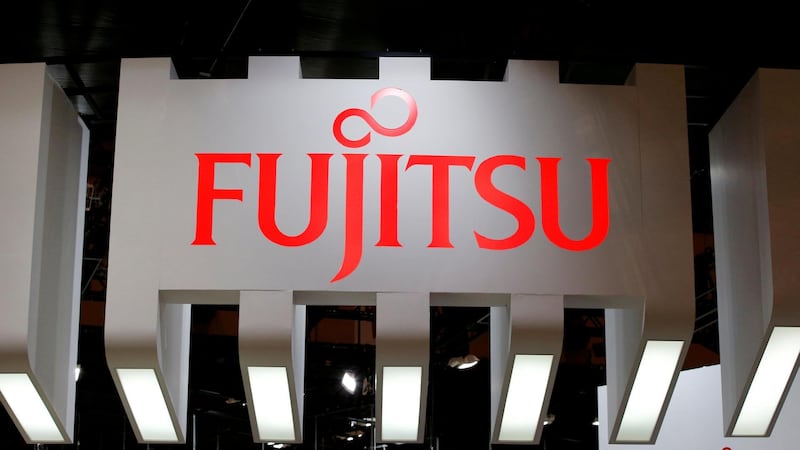 FILE PHOTO: A Fujitsu logo pictured at CEATEC (Combined Exhibition of Advanced Technologies) JAPAN 2016 at the Makuhari Messe in Chiba, Japan, October 3, 2016.   REUTERS/Toru Hanai//File Photo