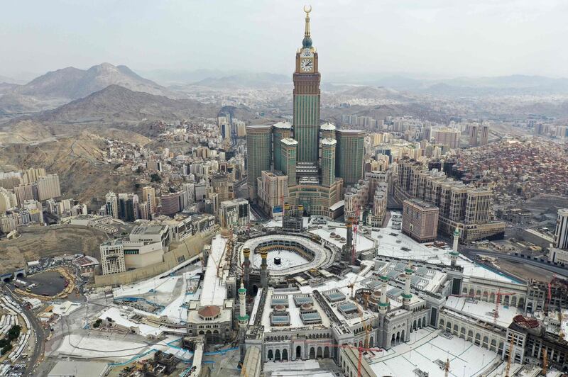 An aerial view shows the Grand Mosque complex in the Saudi holy city of Mecca, during the first day of the Muslim holy fasting month of Ramadan on April 13, 2021. / AFP / -
