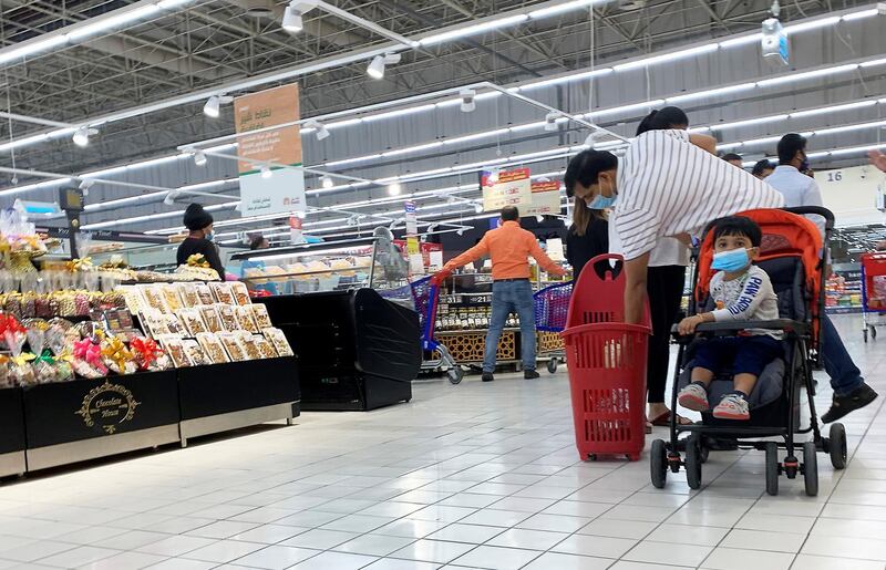 DUBAI, UNITED ARAB EMIRATES , September 13 – 2020 :- Shoppers wearing protective face mask as a preventive measure against the spread of coronavirus inside the Carrefour hypermarket at Ibn Battuta Mall in Dubai.  (Pawan Singh / The National) For News/Stock