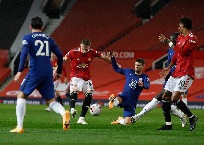 Chelsea's Christian Pulisic, centre right, tries to block a shot from Manchester United's Scott McTominay. AP