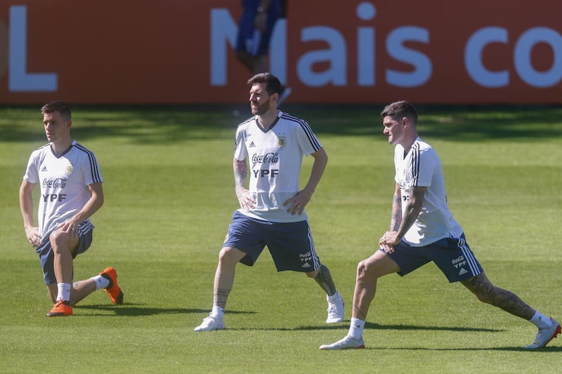 From left: Giovani Lo Celso, Lionel Messi and Rodrigo De Paul do some warm-ups. EPA