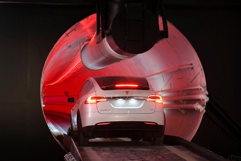 A modified Tesla Model X drives into the tunnel entrance before an unveiling event for the Boring Company Hawthorne test tunnel in Hawthorne, California. Reuters