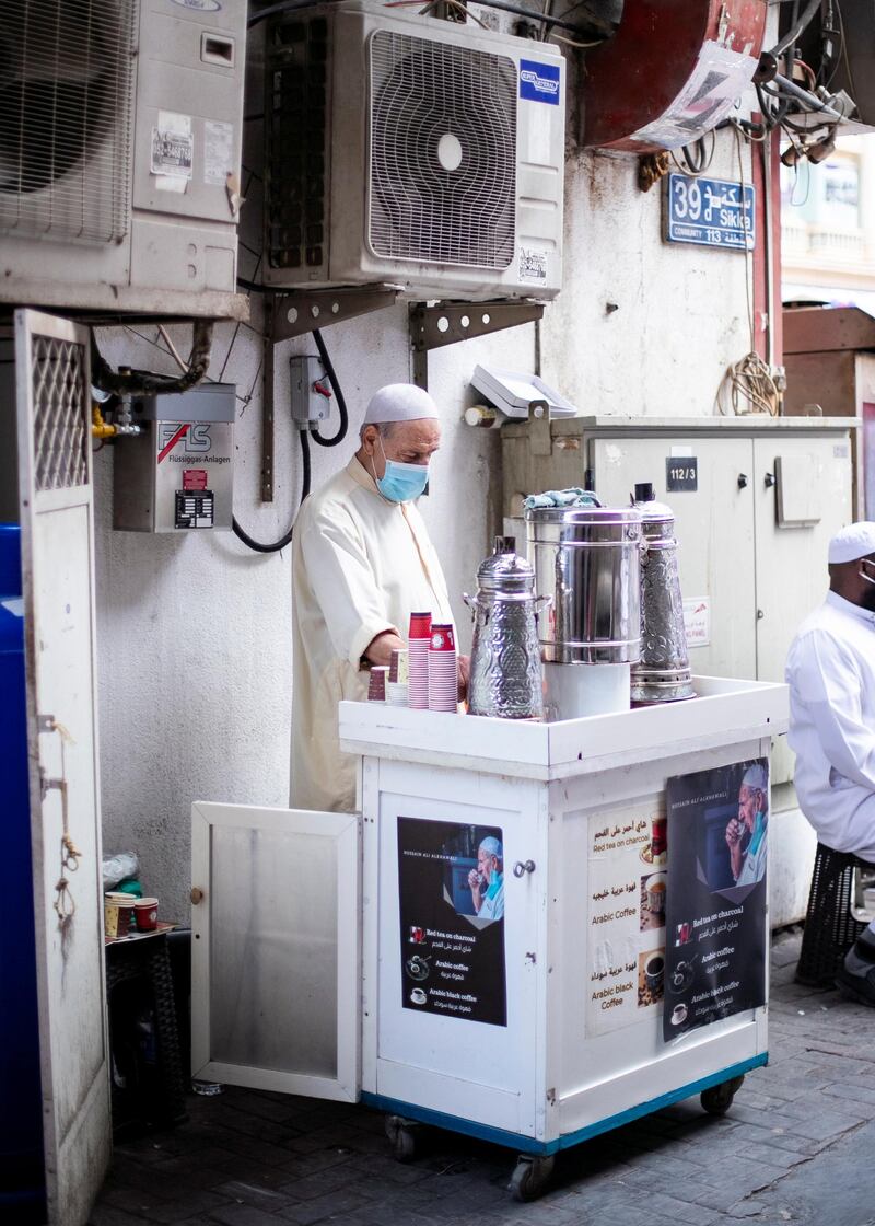 DUBAI, UNITED ARAB EMIRATES.  7 FEBRUARY 2021. 
Hussain Al Khawali runs his coffee stall in Al Sabkha. 
He's been in the same neighborhood, serving coffee to the community, for 40 years. 
Photo: Reem Mohammed / The National
Reporter: