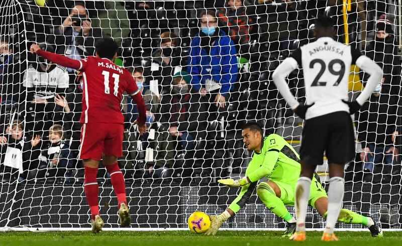 Mohamed Salah of Liverpool scores from the penalty spot against Fulham. EPA
