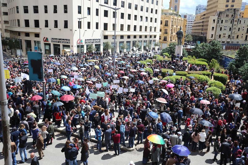 epa07512173 Civil servants protest near the government building against any cuts to their salaries, Beirut, Lebanon, 17 April 2019. Reports state the government is discussing austerity measures to avoid a financial and economic crisis.  EPA/WAEL HAMZEH