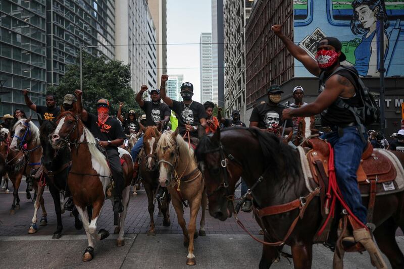 Protesters on horseback rally against the death in Minneapolis police custody of George Floyd, through downtown Houston, Texas, U.S., June 2, 2020.     REUTERS/Adrees Latif     TPX IMAGES OF THE DAY