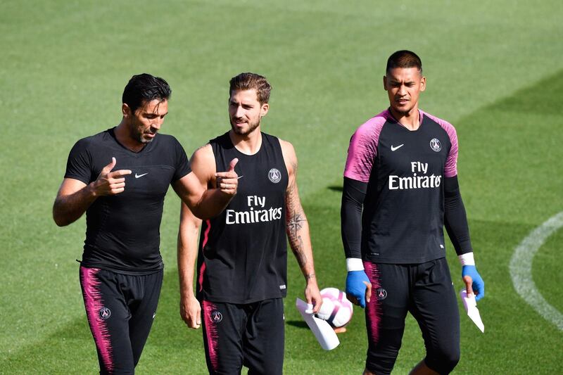 Bufon, Trapp and French goalkeeper Alphonse Areola walk on the pitch during a training session. AFP