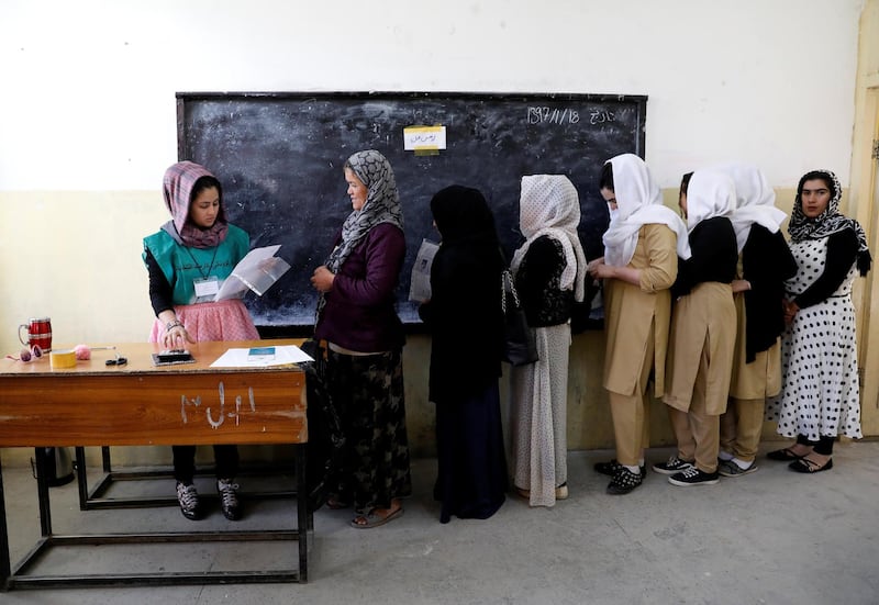 Afghan women arrive at a voter registration centre for the upcoming parliamentary and district council elections in Kabul. Mohammad Ismail / Reuters