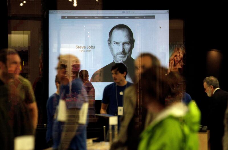 An image of Steve Jobs is shown on a screen at the Apple Store in Santa Monica, Calif., Wednesday, Oct. 5, 2011. Jobs, the Apple founder and former CEO who invented and masterfully marketed ever-sleeker gadgets that transformed everyday technology, from the personal computer to the iPod and iPhone, has died. He was 56. (AP Photo/Jae C. Hong) *** Local Caption ***  Obit Jobs.JPEG-0ff89.jpg