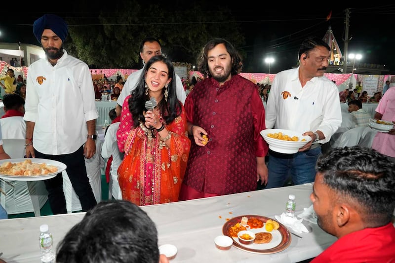 Ambani and Merchant host a communal dinner for 51,000 local villagers ahead of their pre-wedding celebration. AP

