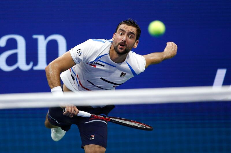 Marin Cilic, of Croatia, serves to Rafael Nadal, of Spain, during the fourth round of the U.S. Open tennis tournament in New York. AP