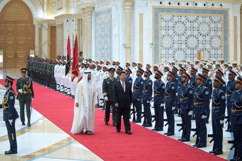 ABU DHABI, UNITED ARAB EMIRATES - July 20, 2018: HH Sheikh Mohamed bin Zayed Al Nahyan Crown Prince of Abu Dhabi Deputy Supreme Commander of the UAE Armed Forces (center L) and HE Xi Jinping, President of China (center R), inspect the UAE Armed Forces honor guard during a reception at the Presidential Palace. 

( Saeed Al Neyadi / Crown Prince Court - Abu Dhabi )
---