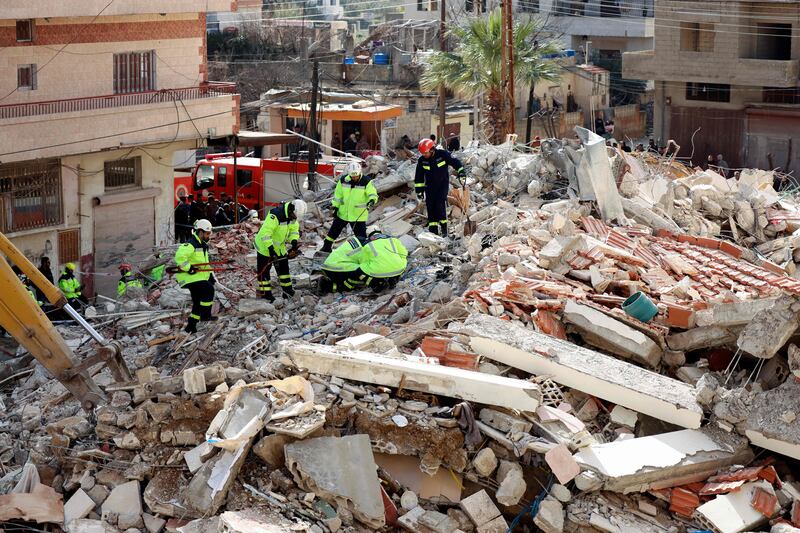 Emirati rescuers sift through the rubble 