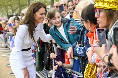 Britain's Kate, Princess of Wales greets well-wishers outside Buckingham Palace, in London, a day before his coronation takes place at Westminster Abbey. AP