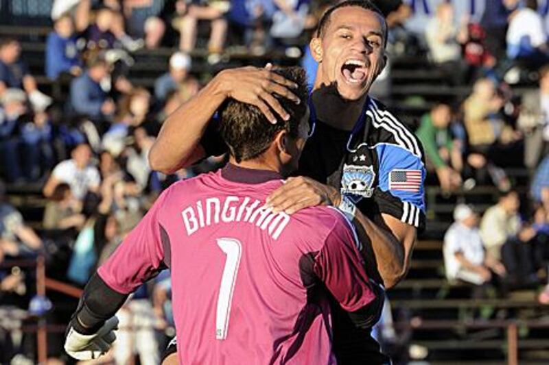 San Jose Earthquakes goalkeeper David Bingham is congratulated by teammate Jason Hernandez after scoring from his own box in a pre-season friendly against West Bromwich Albion.