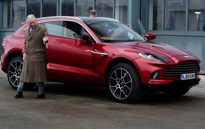 Prince Charles drives Aston Martin's first SUV. Getty Images