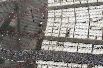 An aerial view of Mina shows pilgrims walking around the Jamarat to throw pebbles at a stone pillar representing the devil, near the tents, during the Hajj on December 09, 2008. (Salah Malkawi/ The National)