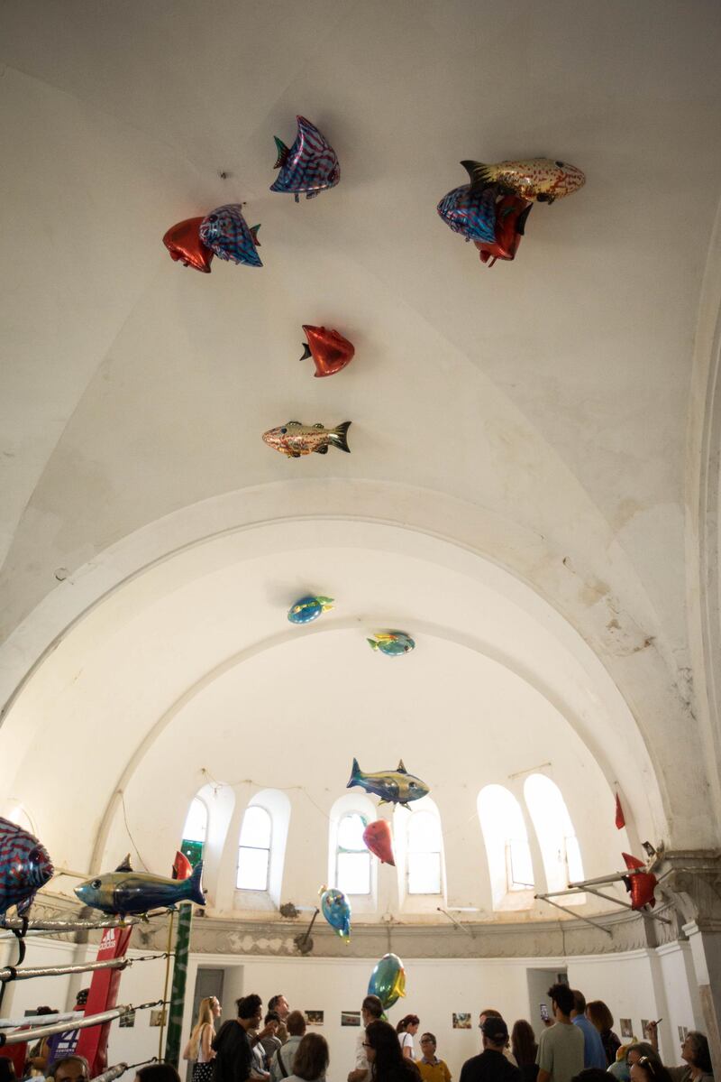 <p>Philippe Parreno&#39;s&nbsp;floating fish (&#39;My Room Is Another Fishbowl&#39;) in Jaou Tunis&#39;s &quot;water&quot; pavilion, held in a French colonialist church turned boxing ring&nbsp;</p>
