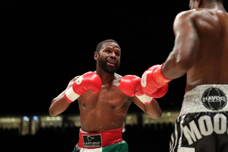 Floyd Mayweather throws a punch against Don Moore during the Abu Dhabi Unity Boxing event at the Etihad Arena in Abu Dhabi. Chris Whiteoak / The National